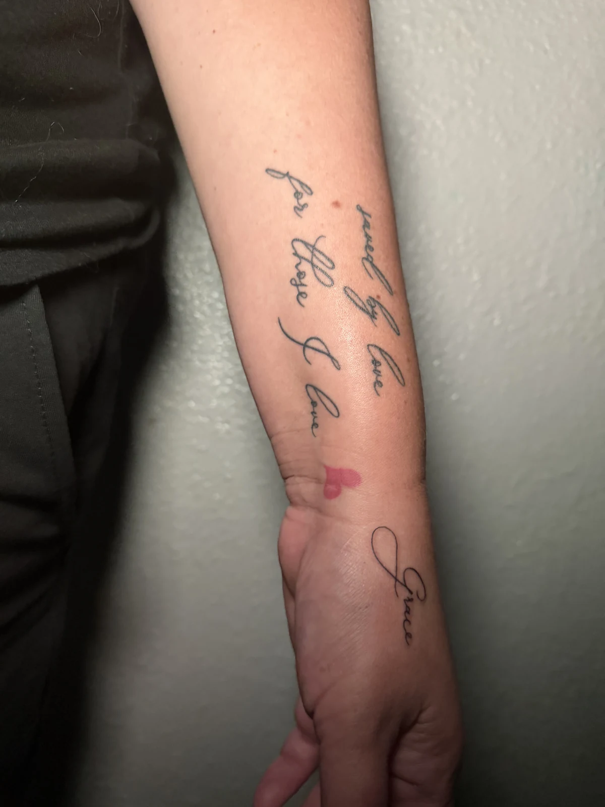 Healed forearm script tattoo